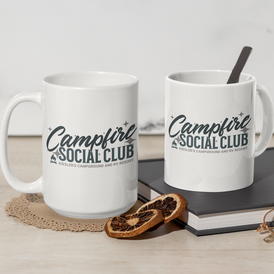 White mug with a fun design that says campfire social club. Kiesler's Campground and RV Resort is name-dropped on the mug. Great souvenir.